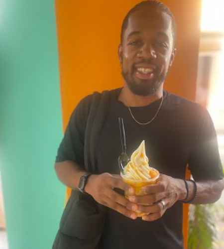 Gary R. Gray Jr. holding a serving of ice cream