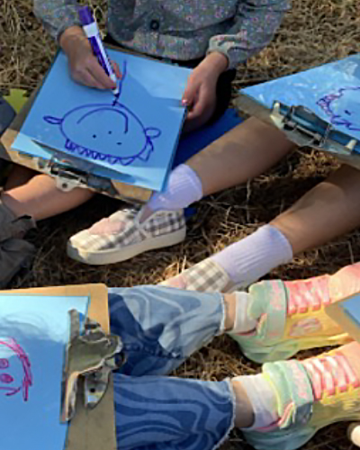 children drawing outside