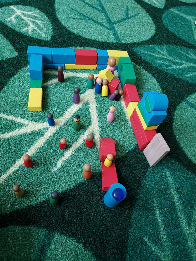 writing workshop materials set up on classroom rug