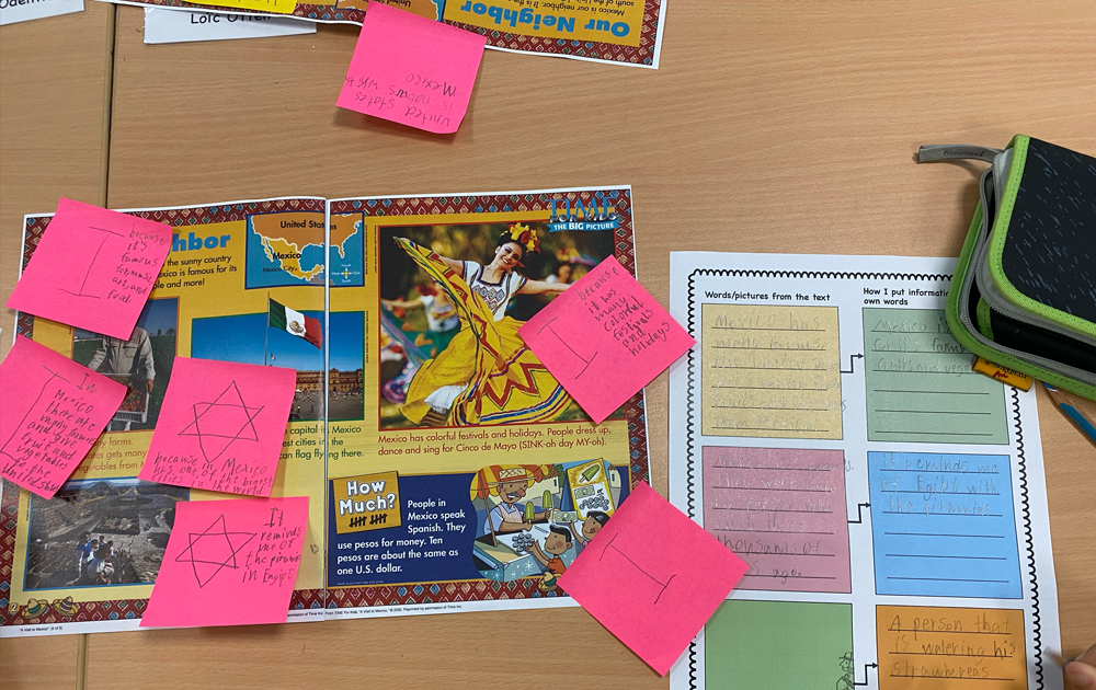 elementary reading assignment annotated with sticky notes