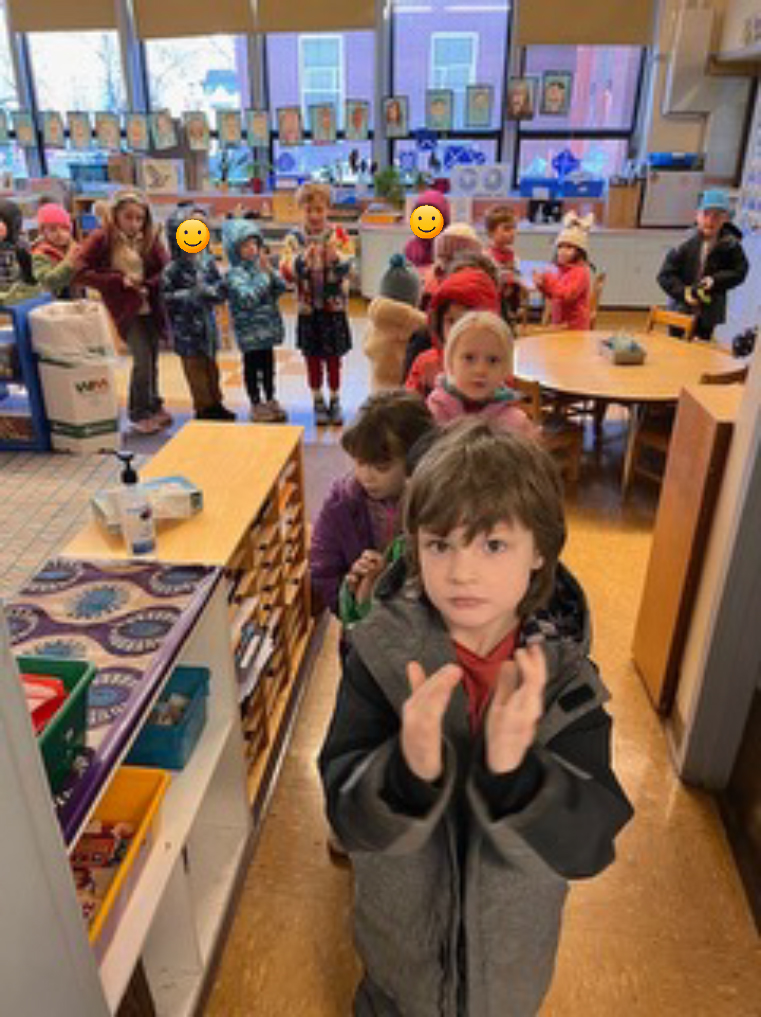 elementary students in line singing a song