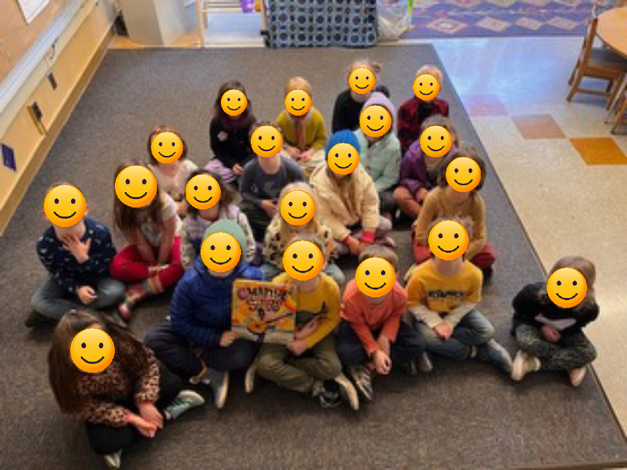 elementary class sitting on floor
