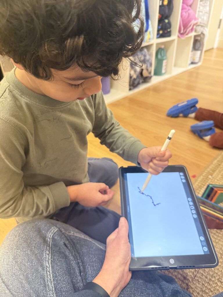 boy marking on tablet with digital pencil