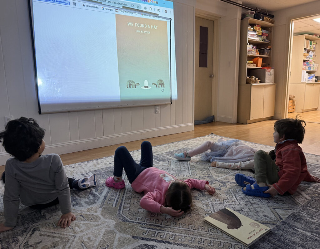 elementary students reading a book they selected from a digital library