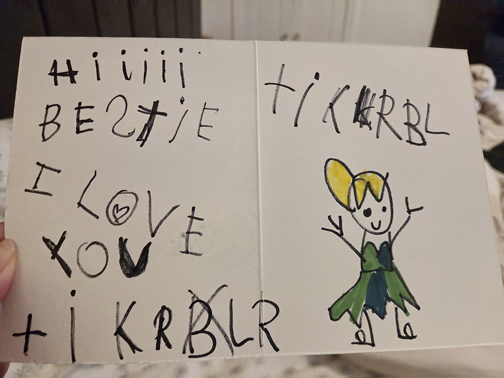 greeting card drawn by six-year-old that says, "Hi, Bestie. I love you. —Tinkerbell"